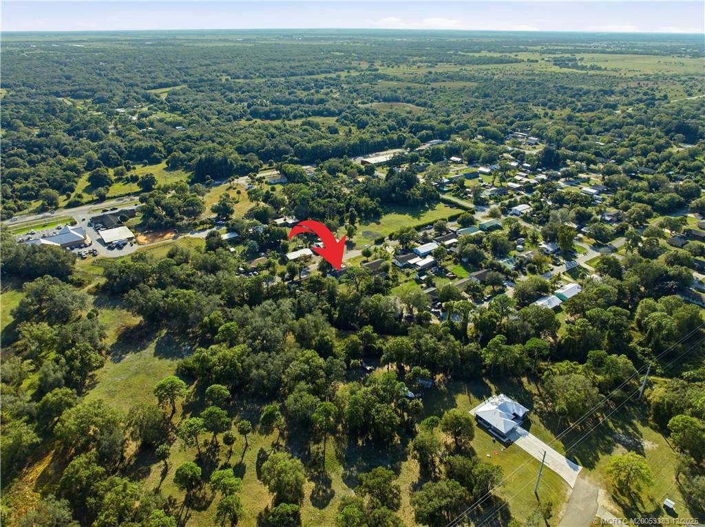 3031 Northwest 2nd Street Okeechobee, FL 34972 - Photo 4 of 19 a view of a lush green field