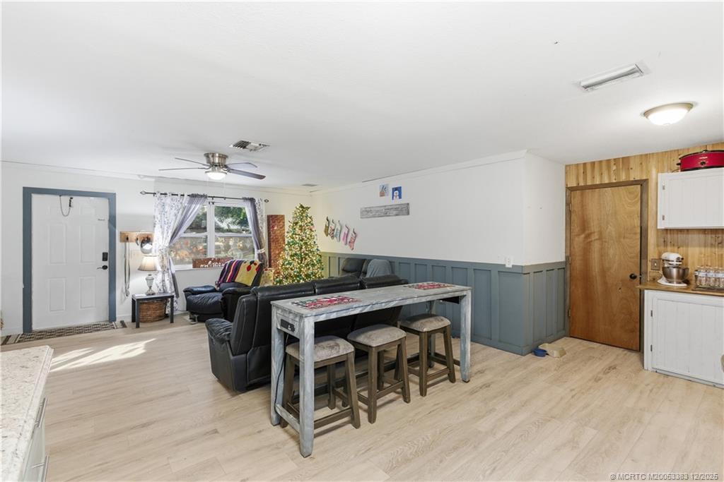3031 Northwest 2nd Street Okeechobee, FL 34972 - Photo 9 of 19 a view of a dining room with furniture