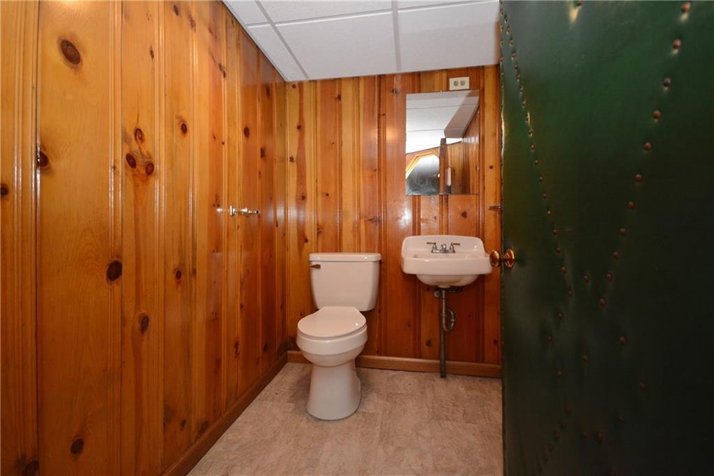 101 Colonial Drive McKees Rocks, PA 15136 - Photo 21 of 25 Half bath in finished basement, with new vinyl flooring