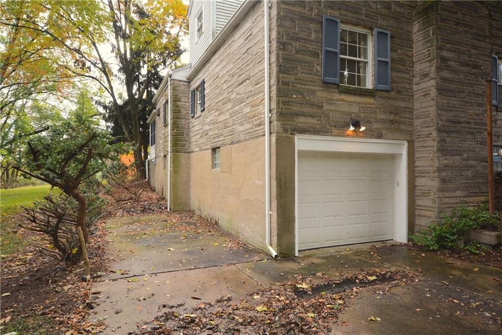 101 Colonial Drive McKees Rocks, PA 15136 - Photo 22 of 25 Exterior view of 2-car tandem garage and additional parking pad