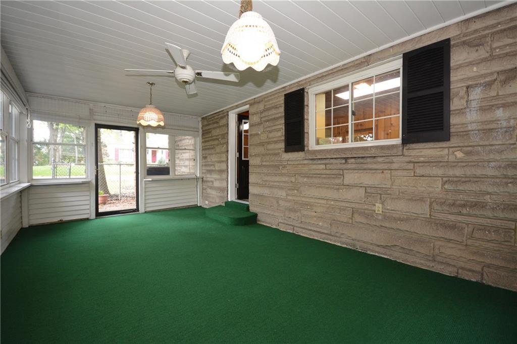 101 Colonial Drive McKees Rocks, PA 15136 - Photo 10 of 25 Enclosed sun porch includes new indoor/outdoor carpeting and ceiling fan.