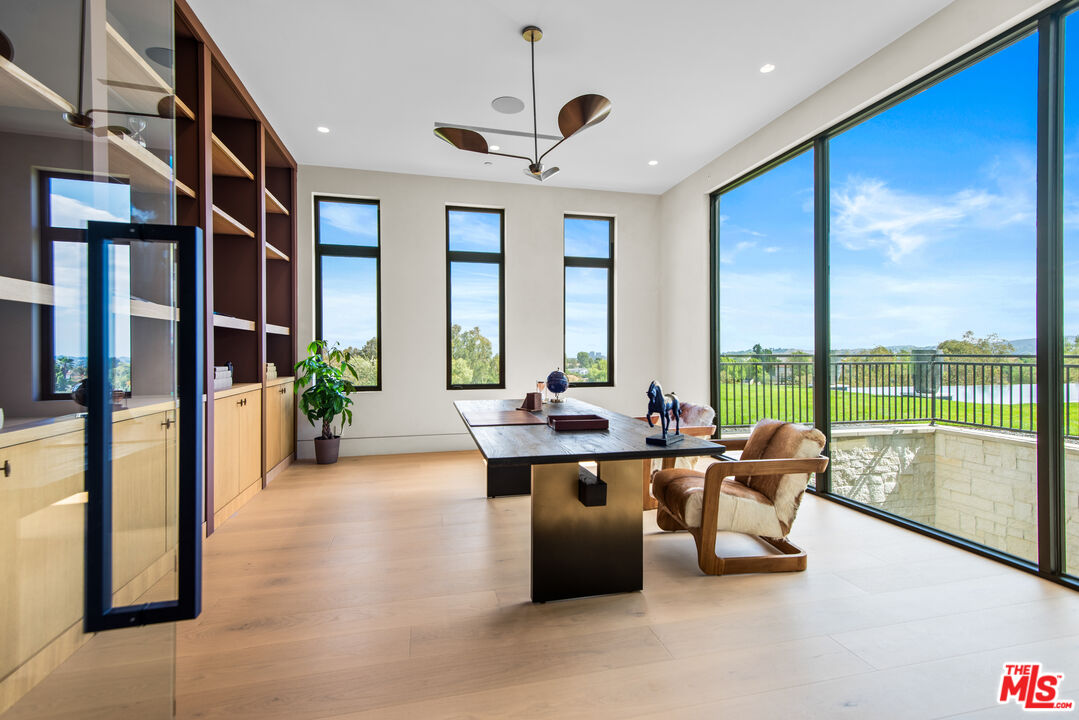 5340 Whitman Road Hidden Hills, CA 91302 - Photo 16 of 57 a living room with furniture and a large window