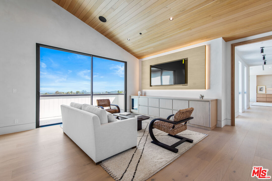 5340 Whitman Road Hidden Hills, CA 91302 - Photo 28 of 57 a living room with furniture and a large window