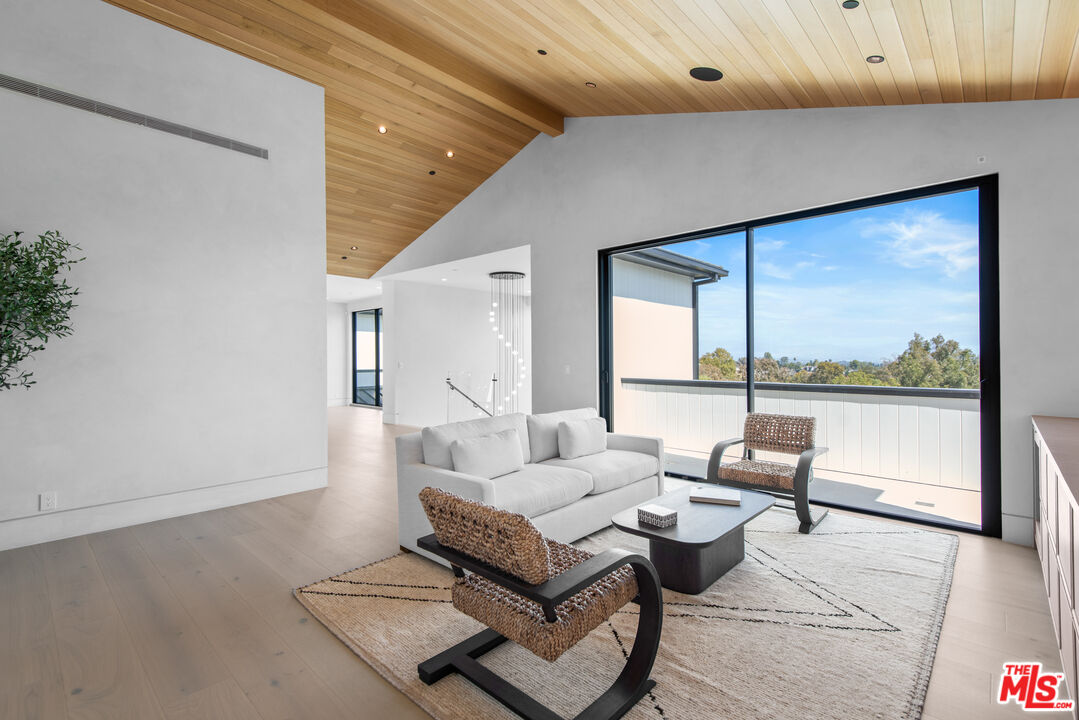 5340 Whitman Road Hidden Hills, CA 91302 - Photo 31 of 57 a living room with furniture and a large window