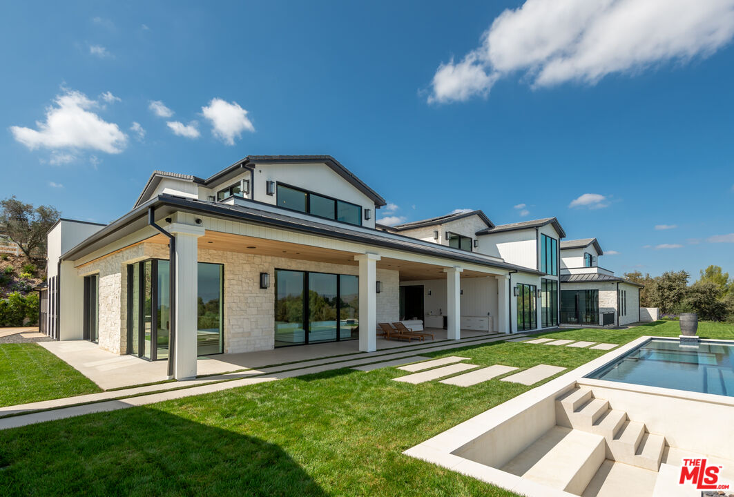 5340 Whitman Road Hidden Hills, CA 91302 - Photo 39 of 57 a front view of a house with a yard