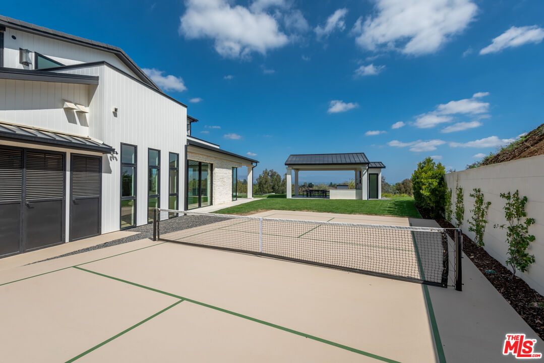 5340 Whitman Road Hidden Hills, CA 91302 - Photo 41 of 57 a house view with a garden space