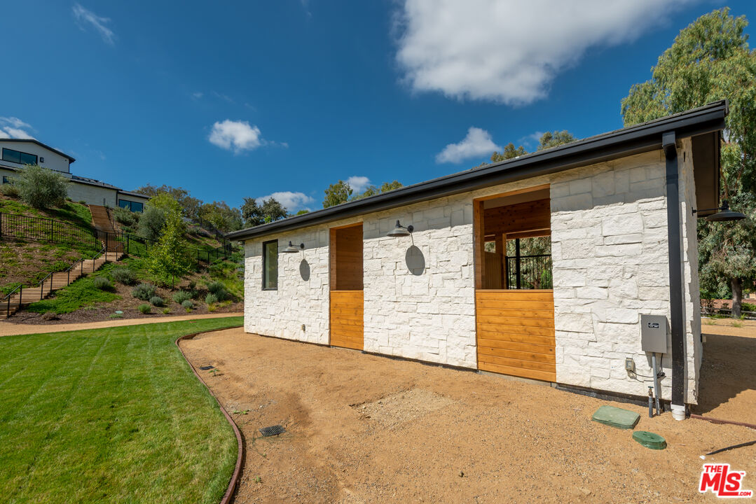 5340 Whitman Road Hidden Hills, CA 91302 - Photo 46 of 57 a view of a house with backyard and garden