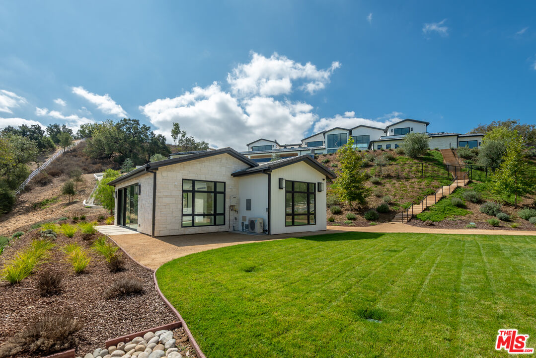 5340 Whitman Road Hidden Hills, CA 91302 - Photo 47 of 57 a front view of a house with garden