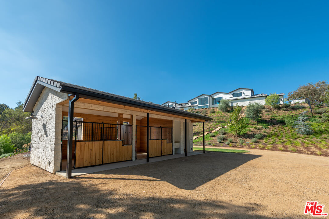 5340 Whitman Road Hidden Hills, CA 91302 - Photo 48 of 57 a view of a house with backyard and porch
