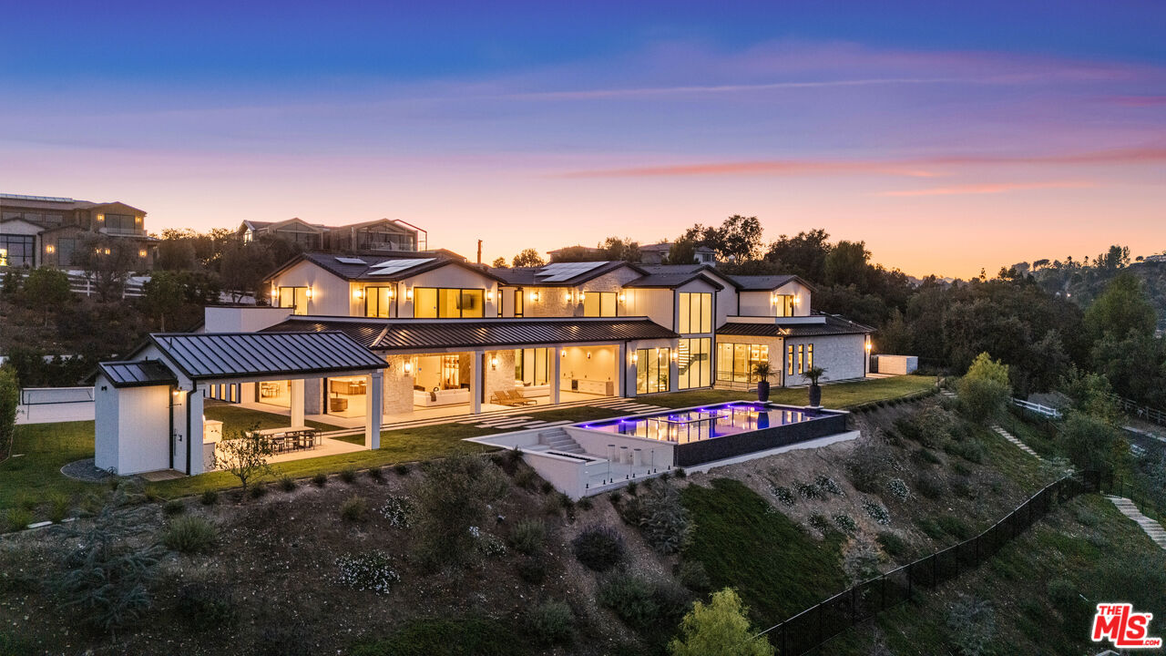 5340 Whitman Road Hidden Hills, CA 91302 - Photo 52 of 57 a view of a house with pool and a yard