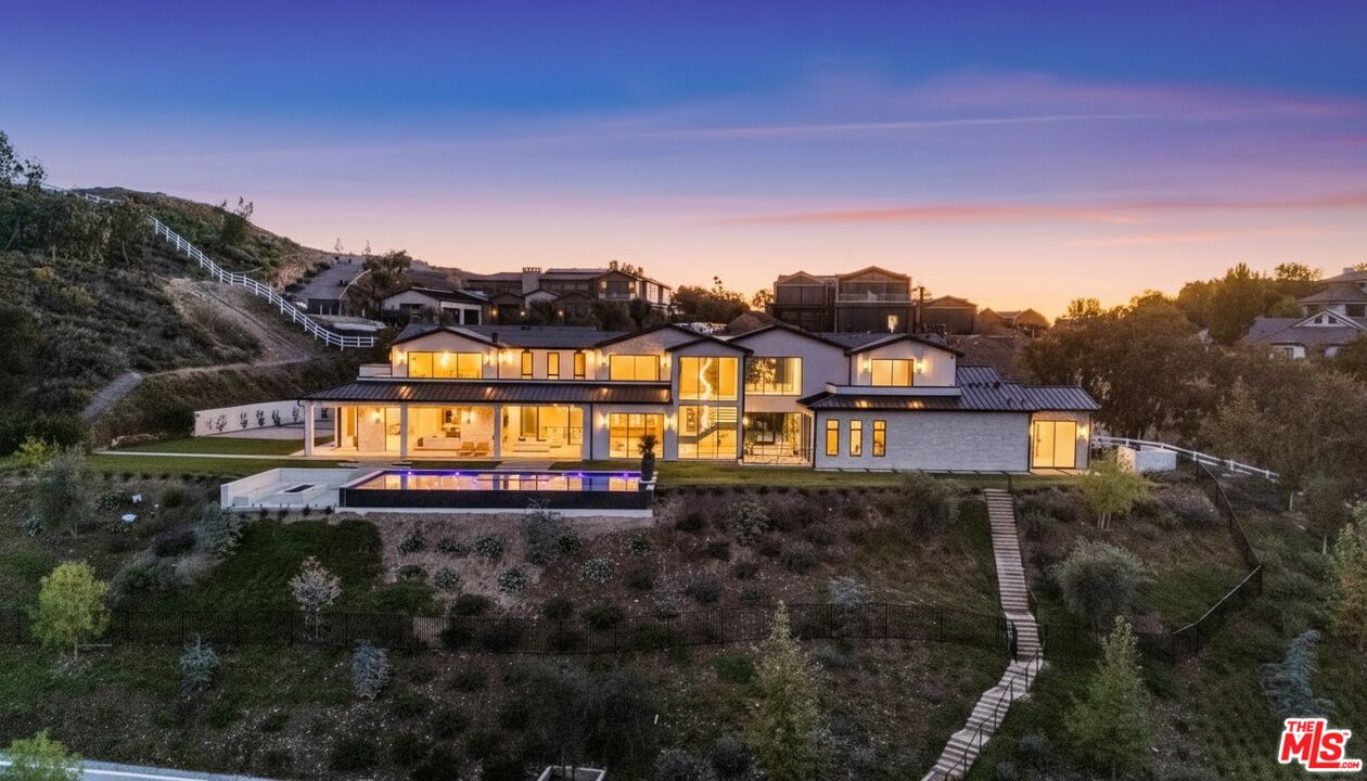5340 Whitman Road Hidden Hills, CA 91302 - Photo 56 of 57 a view of a house with a yard and a large tree