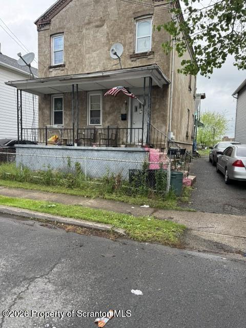 343 Phelps Street Scranton, PA 18509 - Photo 1 of 20 a front view of a house with porch and outdoor seating