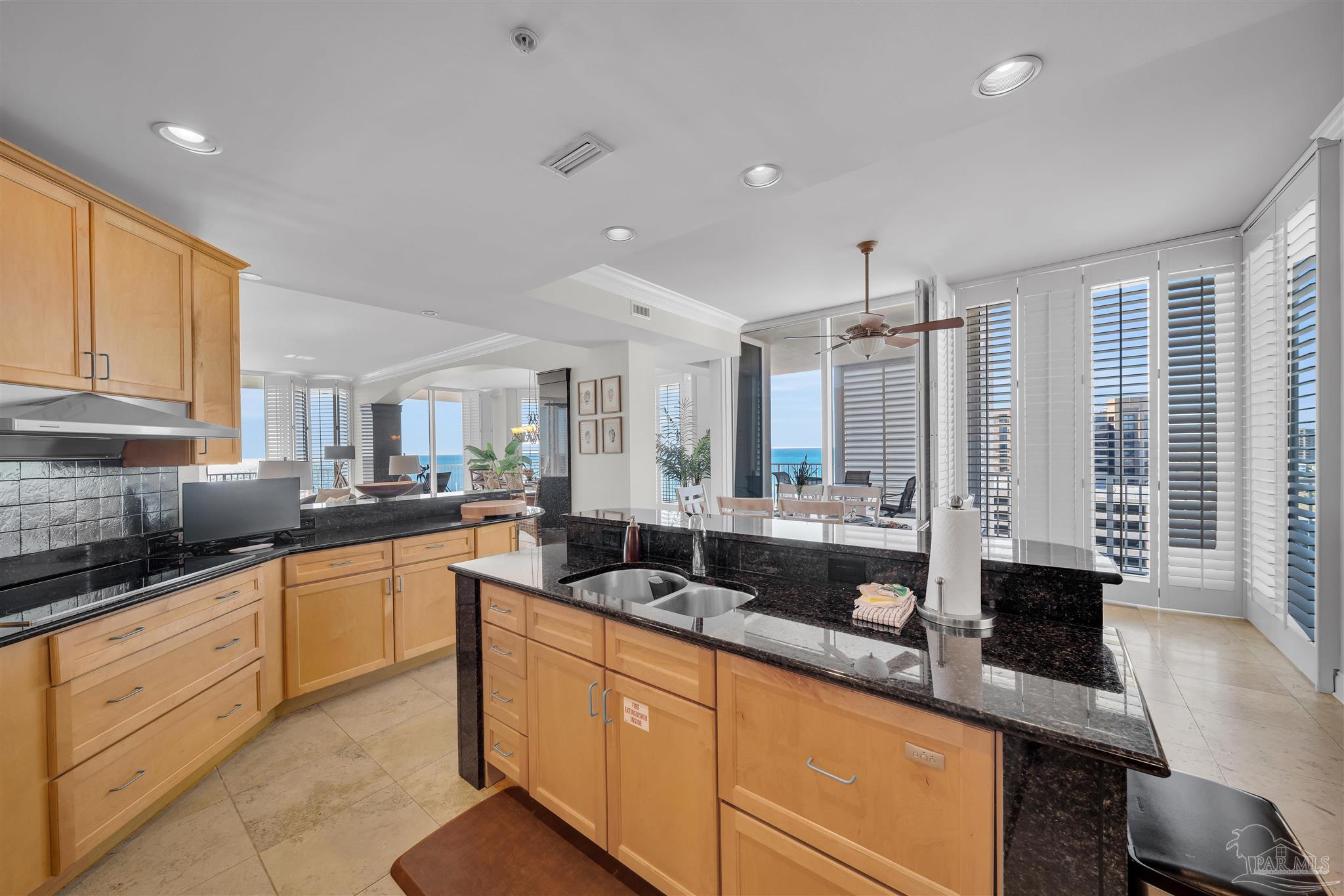 17361 Perdido Key Drive, Unit 1002W Perdido Key, FL 32507 - Photo 11 of 64 a large kitchen with granite countertop a sink and white cabinets