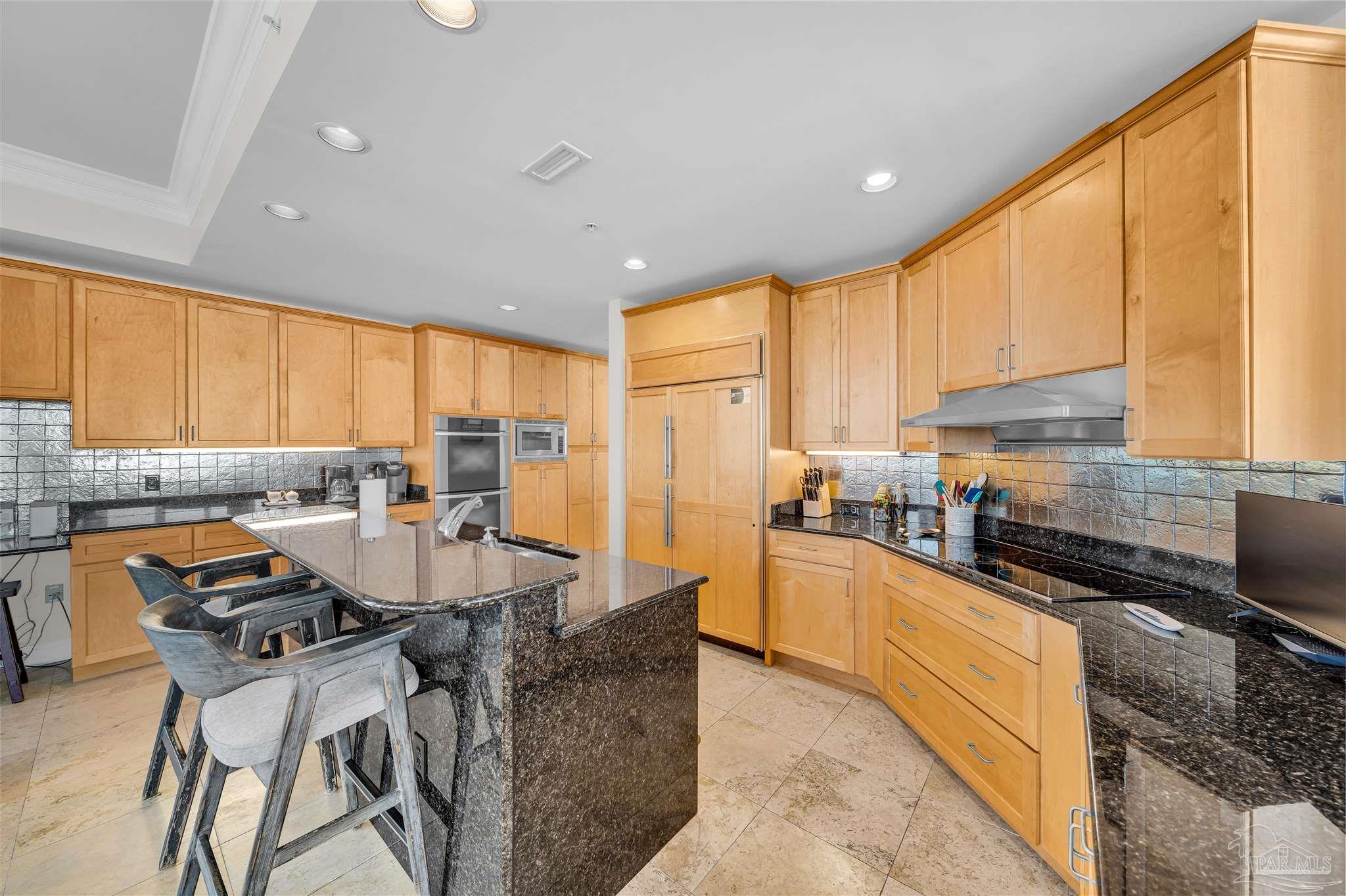 17361 Perdido Key Drive, Unit 1002W Perdido Key, FL 32507 - Photo 12 of 64 a kitchen with stainless steel appliances granite countertop sink stove top oven and cabinets