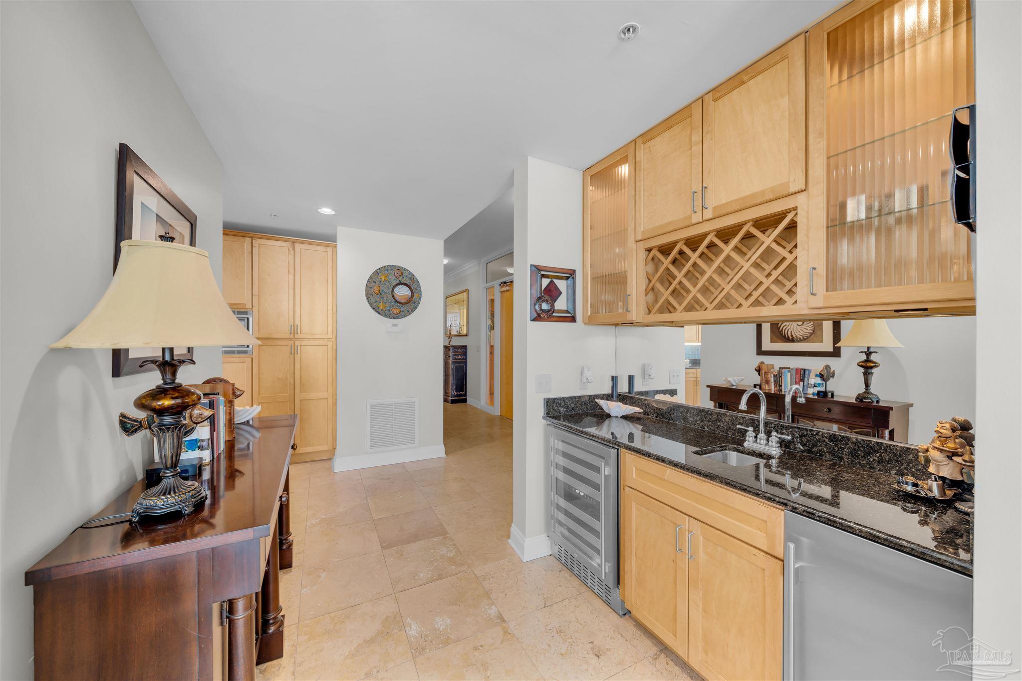 17361 Perdido Key Drive, Unit 1002W Perdido Key, FL 32507 - Photo 14 of 64 a kitchen with stainless steel appliances granite countertop a sink and cabinets