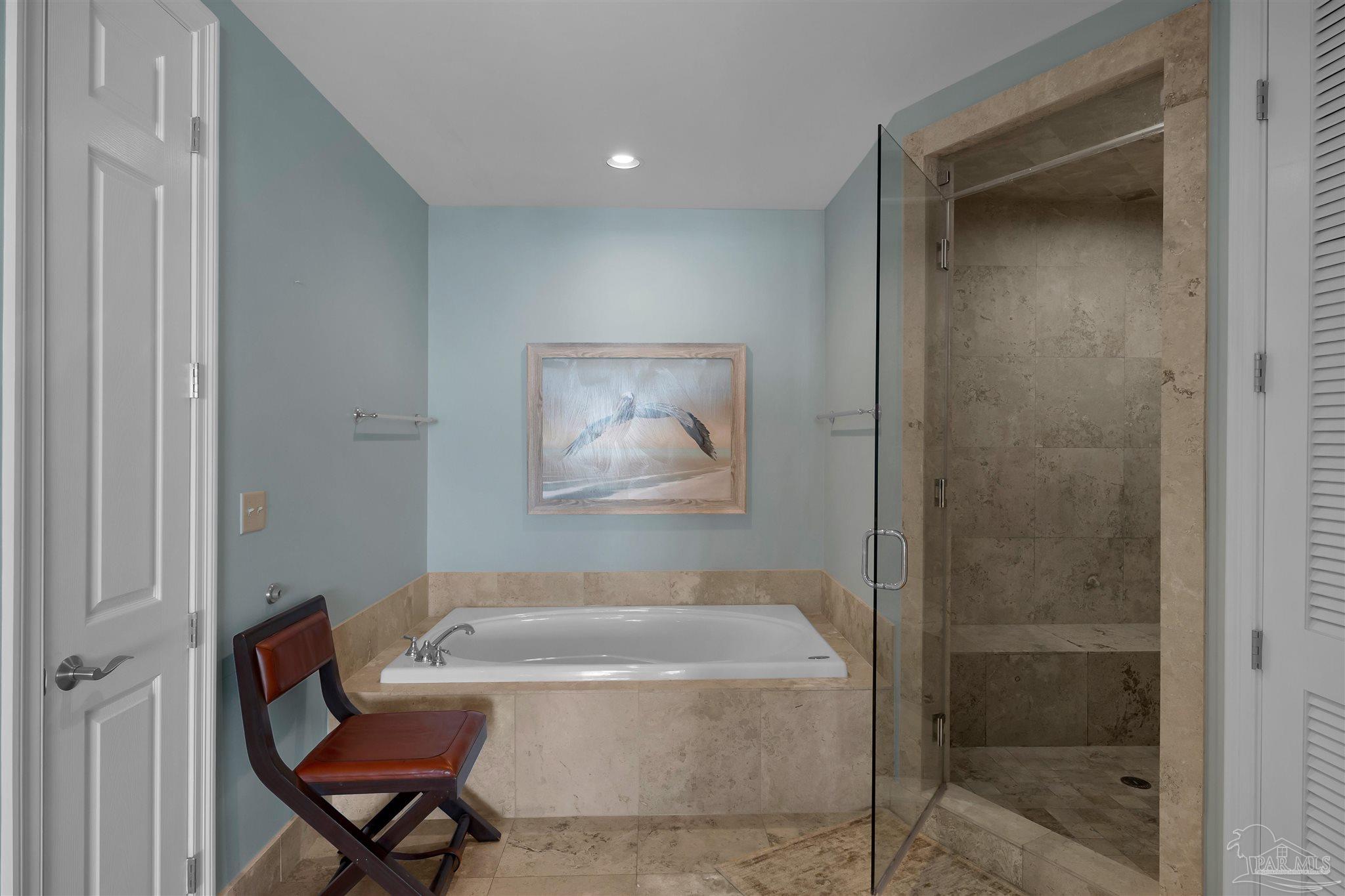 17361 Perdido Key Drive, Unit 1002W Perdido Key, FL 32507 - Photo 20 of 64 a bathroom with a bathtub and a shower