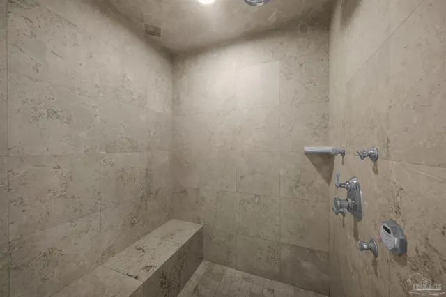 a bathroom with a shower and a tub