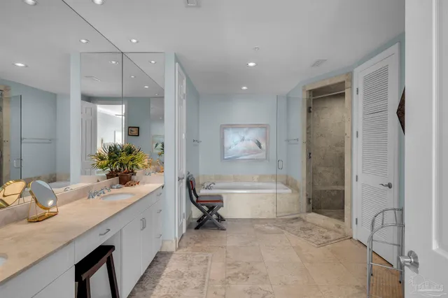 a living room with furniture a lamp wooden floor and a cabinet