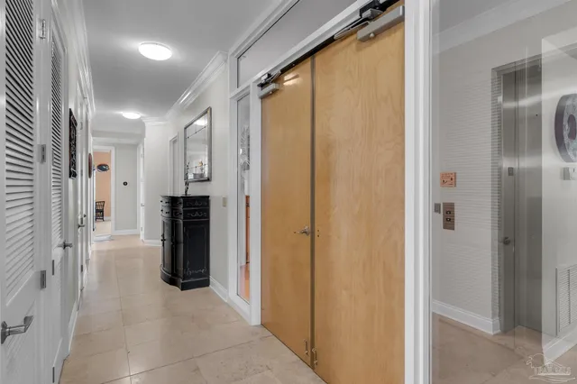 a bedroom with bed and a chandelier