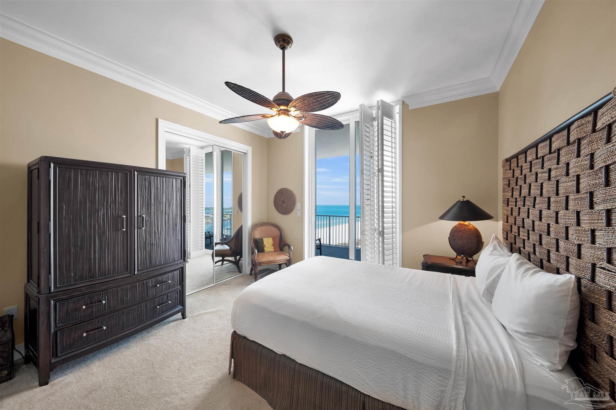 17361 Perdido Key Drive, Unit 1002W Perdido Key, FL 32507 - Photo 25 of 64 a bedroom with bed and a chandelier