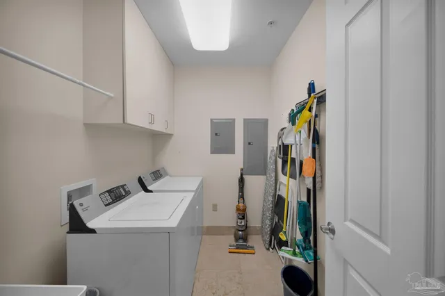 a bedroom with two beds and a chandelier