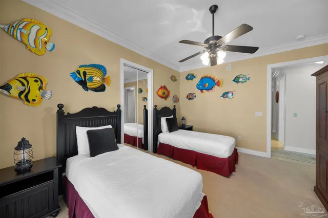 a bedroom with a bed and a large window with the outer view