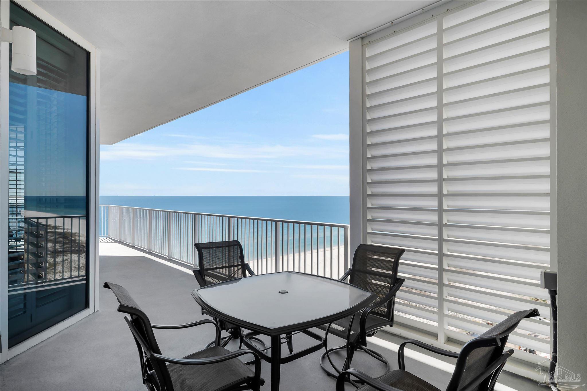 17361 Perdido Key Drive, Unit 1002W Perdido Key, FL 32507 - Photo 38 of 64 a view of a room with a table and chairs