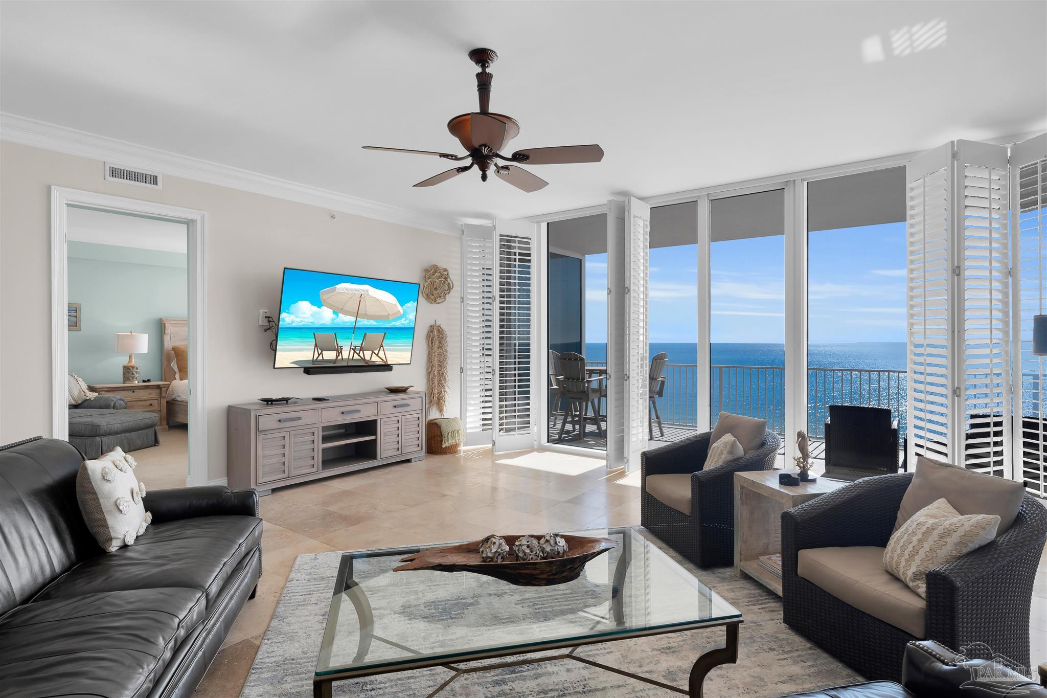 17361 Perdido Key Drive, Unit 1002W Perdido Key, FL 32507 - Photo 4 of 64 a living room with furniture and a flat screen tv