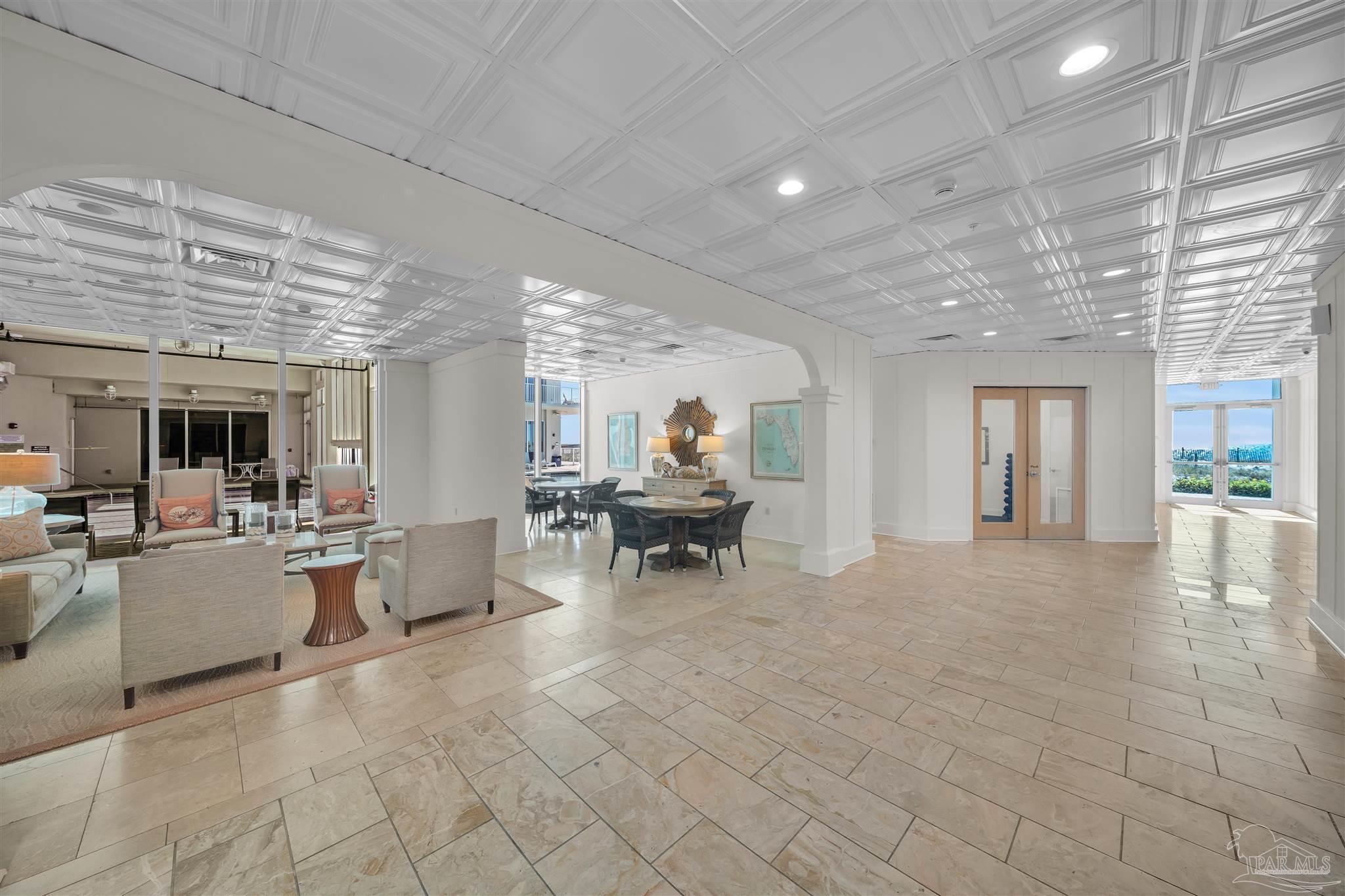 17361 Perdido Key Drive, Unit 1002W Perdido Key, FL 32507 - Photo 49 of 64 a lobby with furniture and a chandelier