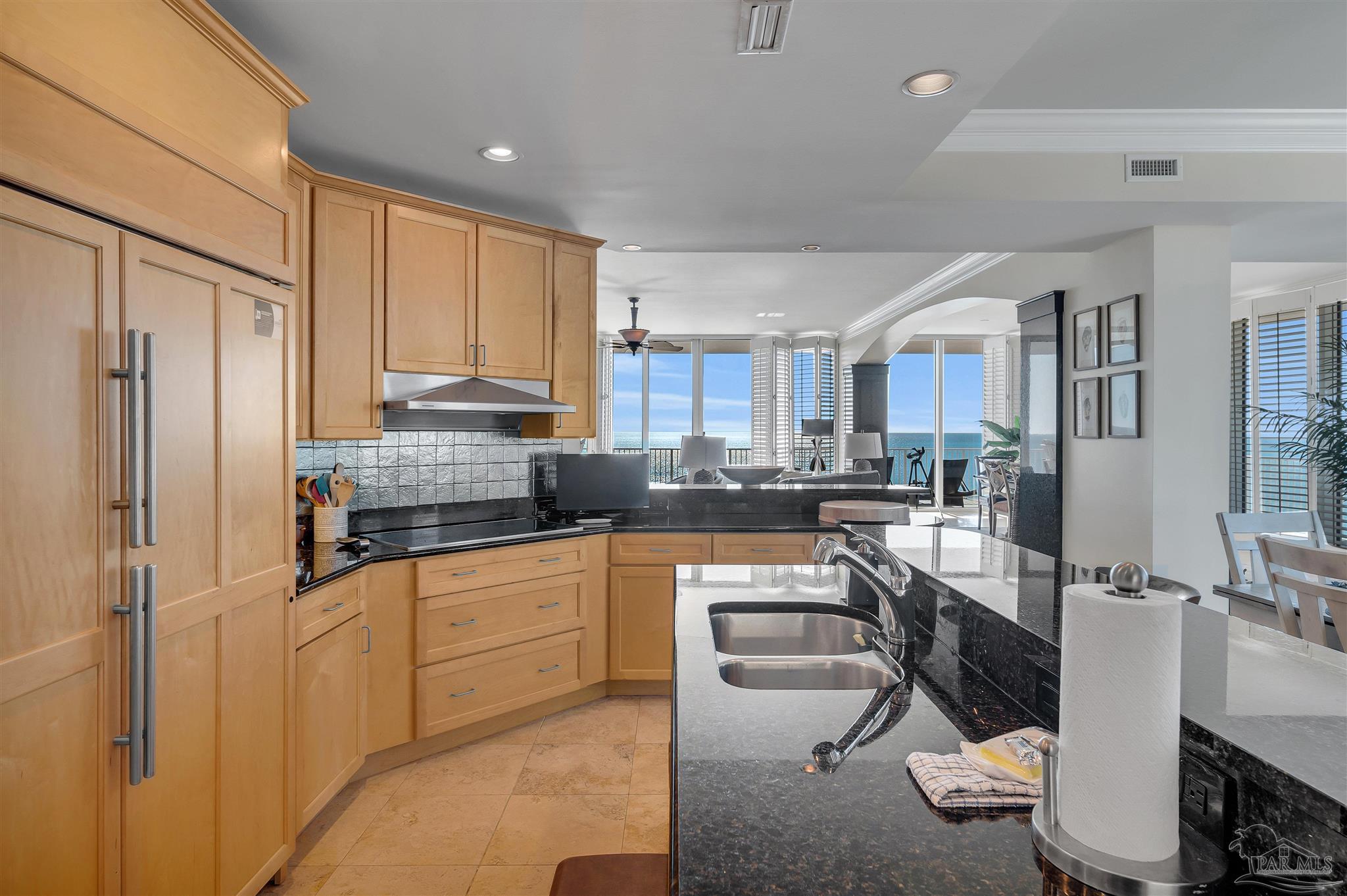 17361 Perdido Key Drive, Unit 1002W Perdido Key, FL 32507 - Photo 9 of 64 a kitchen with stainless steel appliances granite countertop a refrigerator and a stove top oven