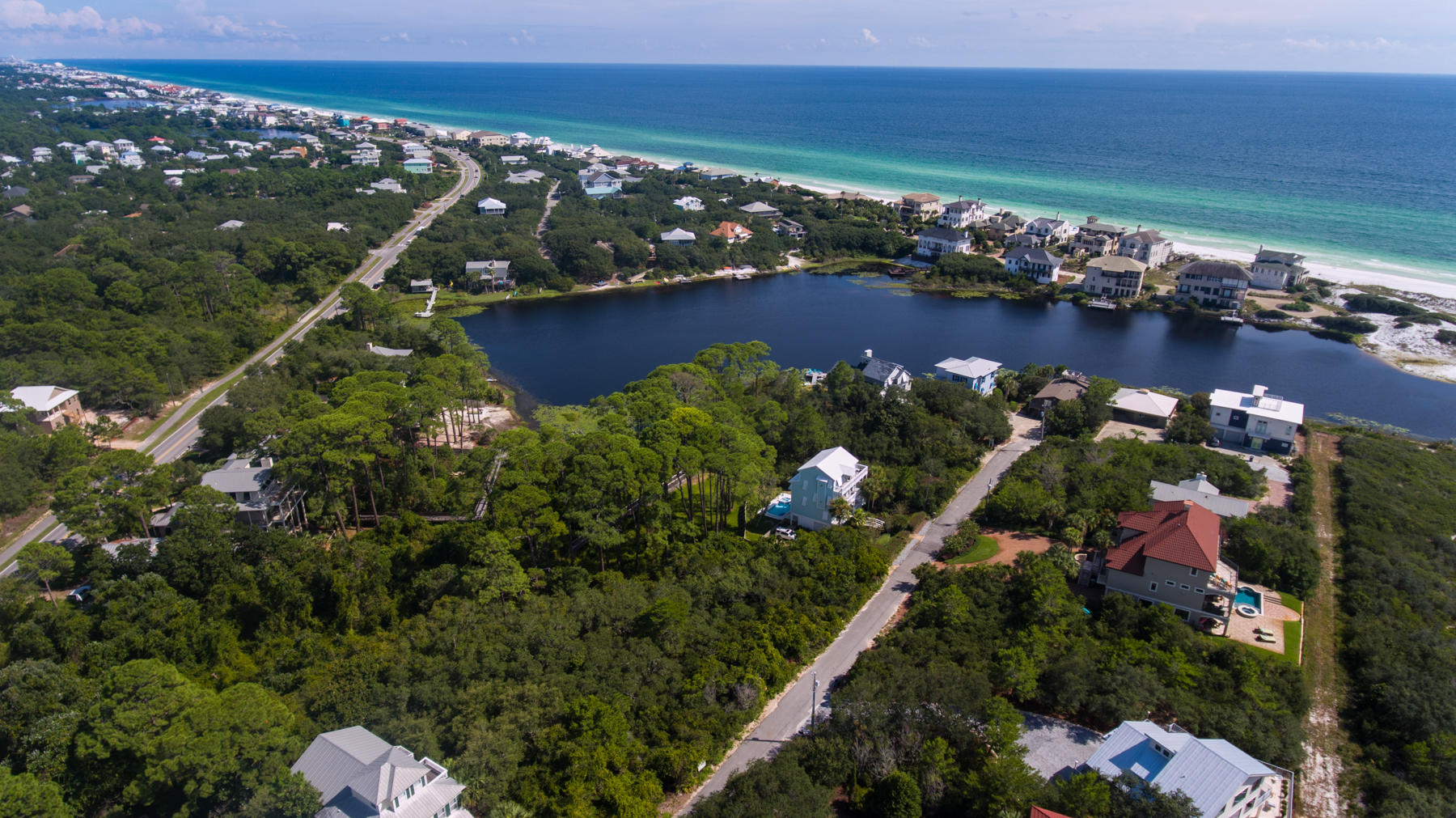 Lot 10 Loon Lake Drive Santa Rosa Beach, FL 32459 - Photo 25 of 49 an aerial view of a houses with ocean view