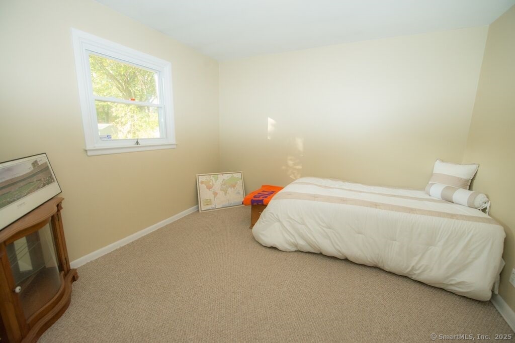 51 Waller Road Bridgeport, CT 06606 - Photo 9 of 11 a bedroom with a bed and a tv