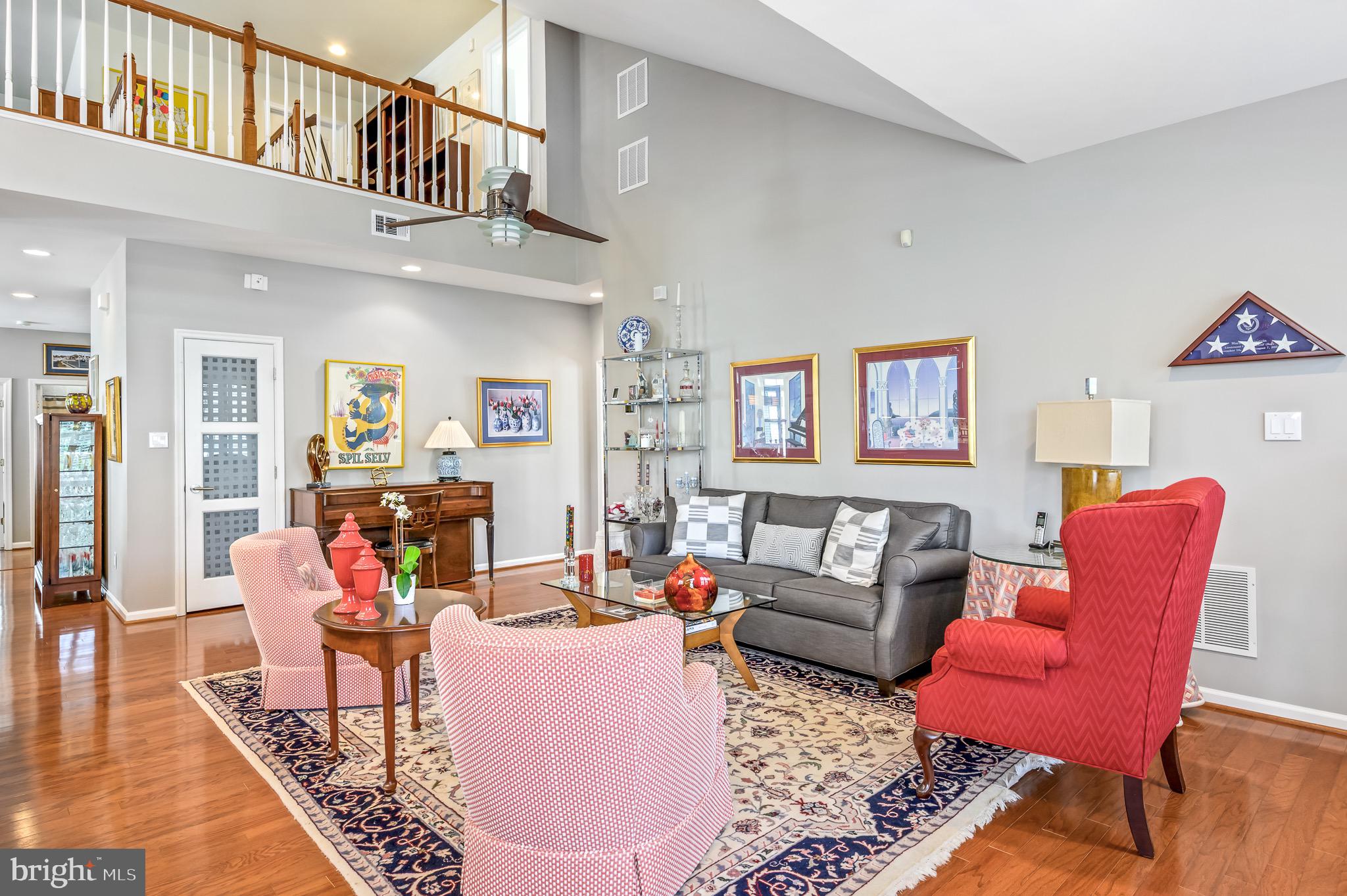 44550 Baltray Circle Ashburn, VA 20147 - Photo 16 of 44 a living room with furniture or couch and a dining table