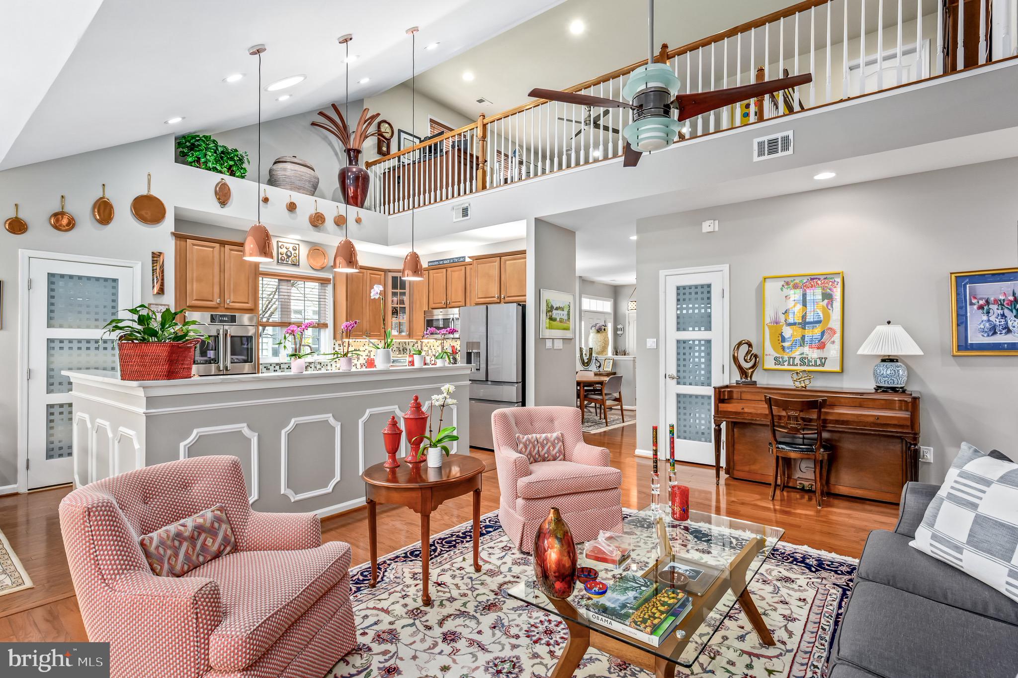 44550 Baltray Circle Ashburn, VA 20147 - Photo 17 of 44 a living room with furniture kitchen view and a wooden floor