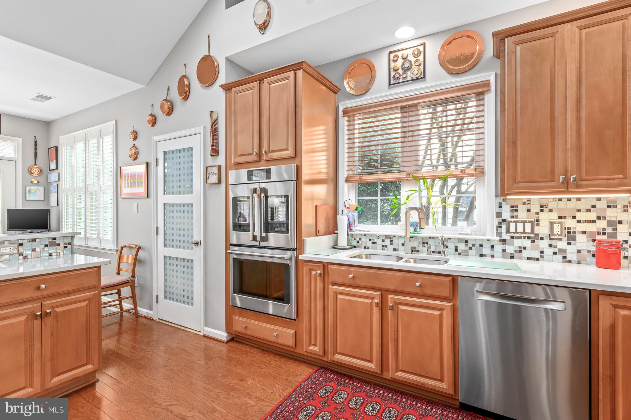 44550 Baltray Circle Ashburn, VA 20147 - Photo 2 of 44 a kitchen with cabinets and window