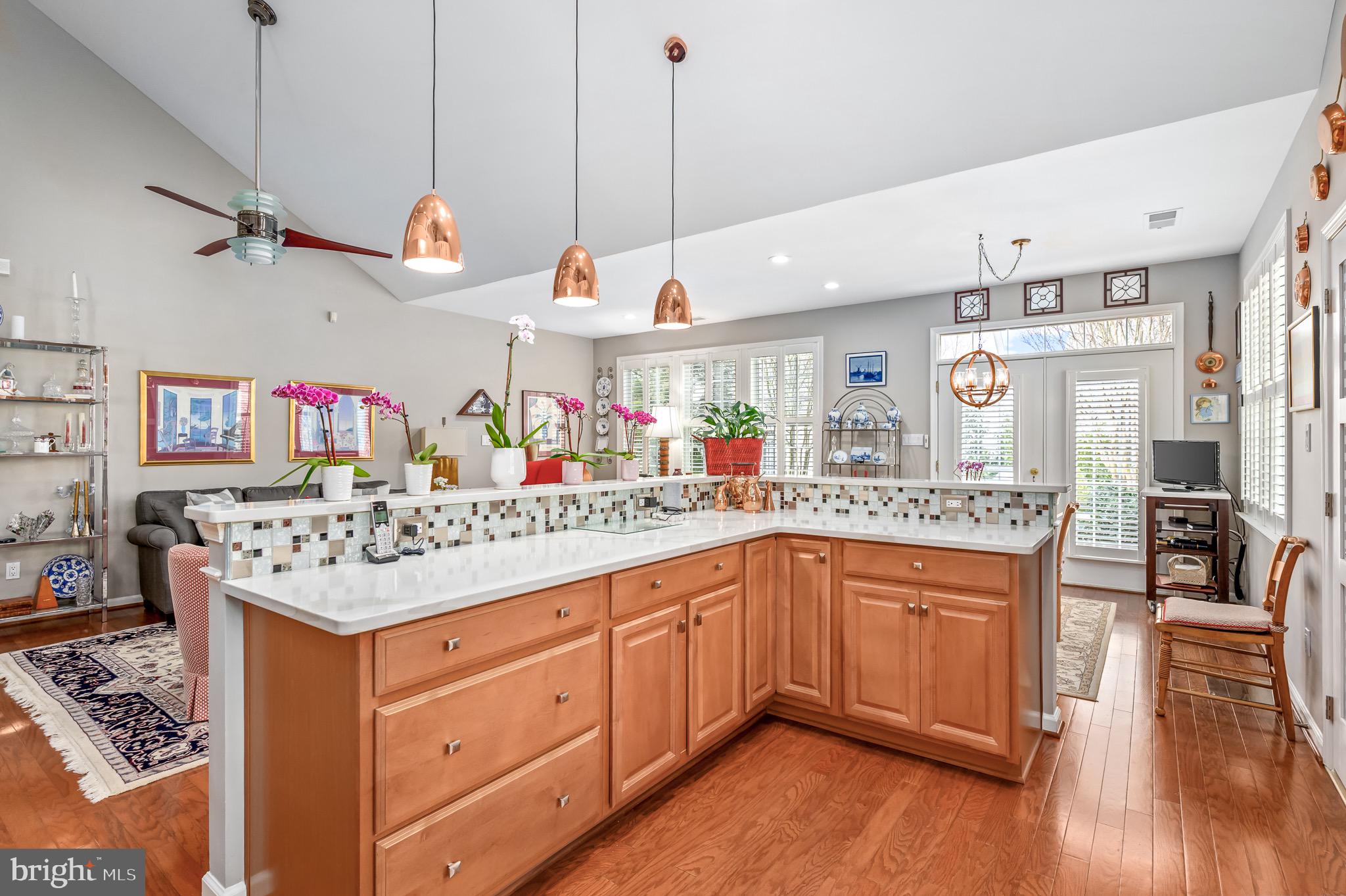 44550 Baltray Circle Ashburn, VA 20147 - Photo 21 of 44 a kitchen with a stove a refrigerator and wooden floor