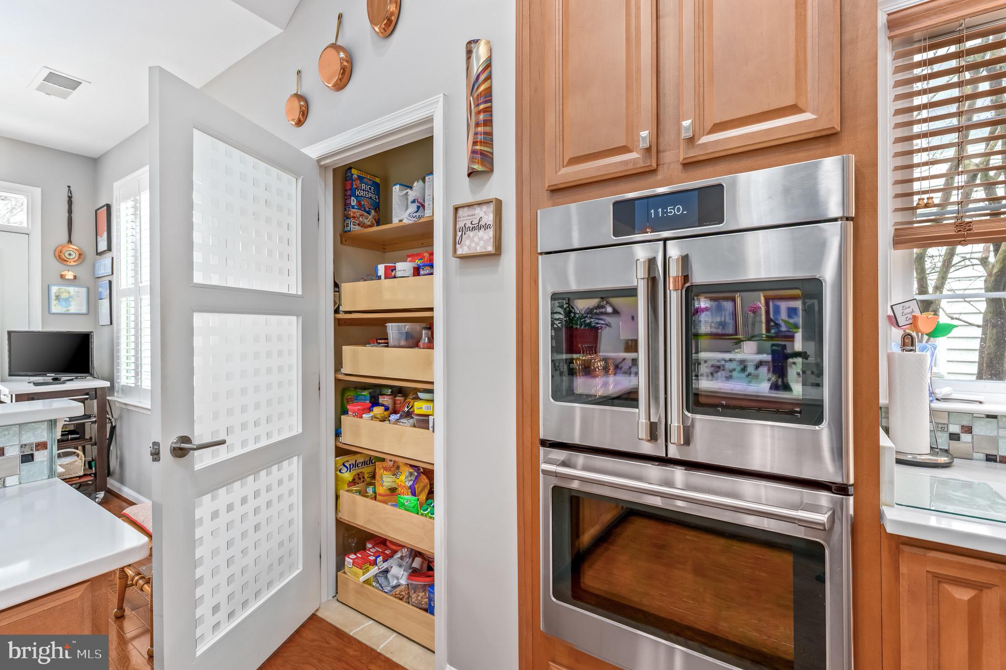 44550 Baltray Circle Ashburn, VA 20147 - Photo 22 of 44 a kitchen with stainless steel appliances granite countertop a refrigerator and a stove
