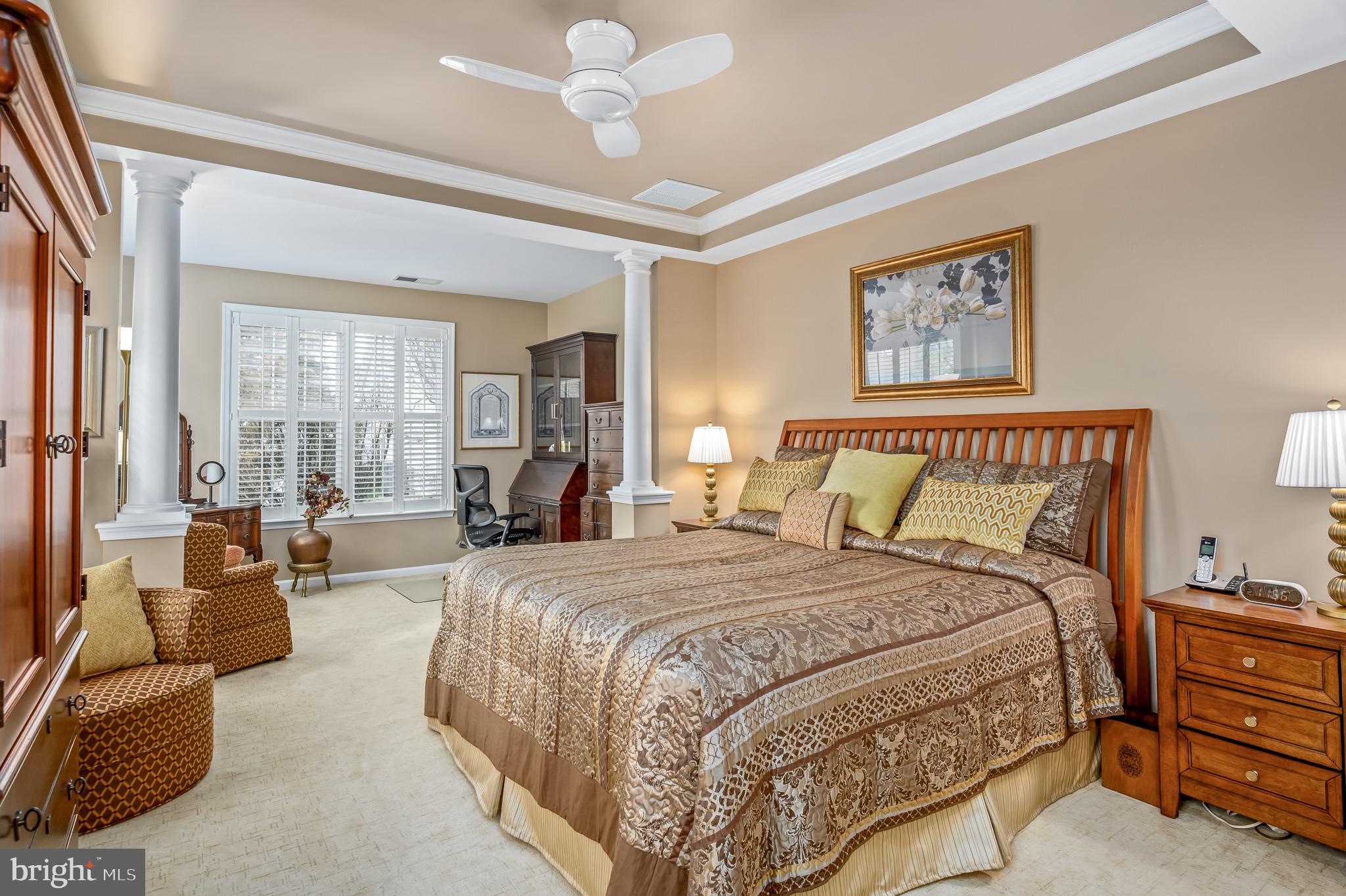 44550 Baltray Circle Ashburn, VA 20147 - Photo 24 of 44 a spacious bedroom with a large bed couch and a window