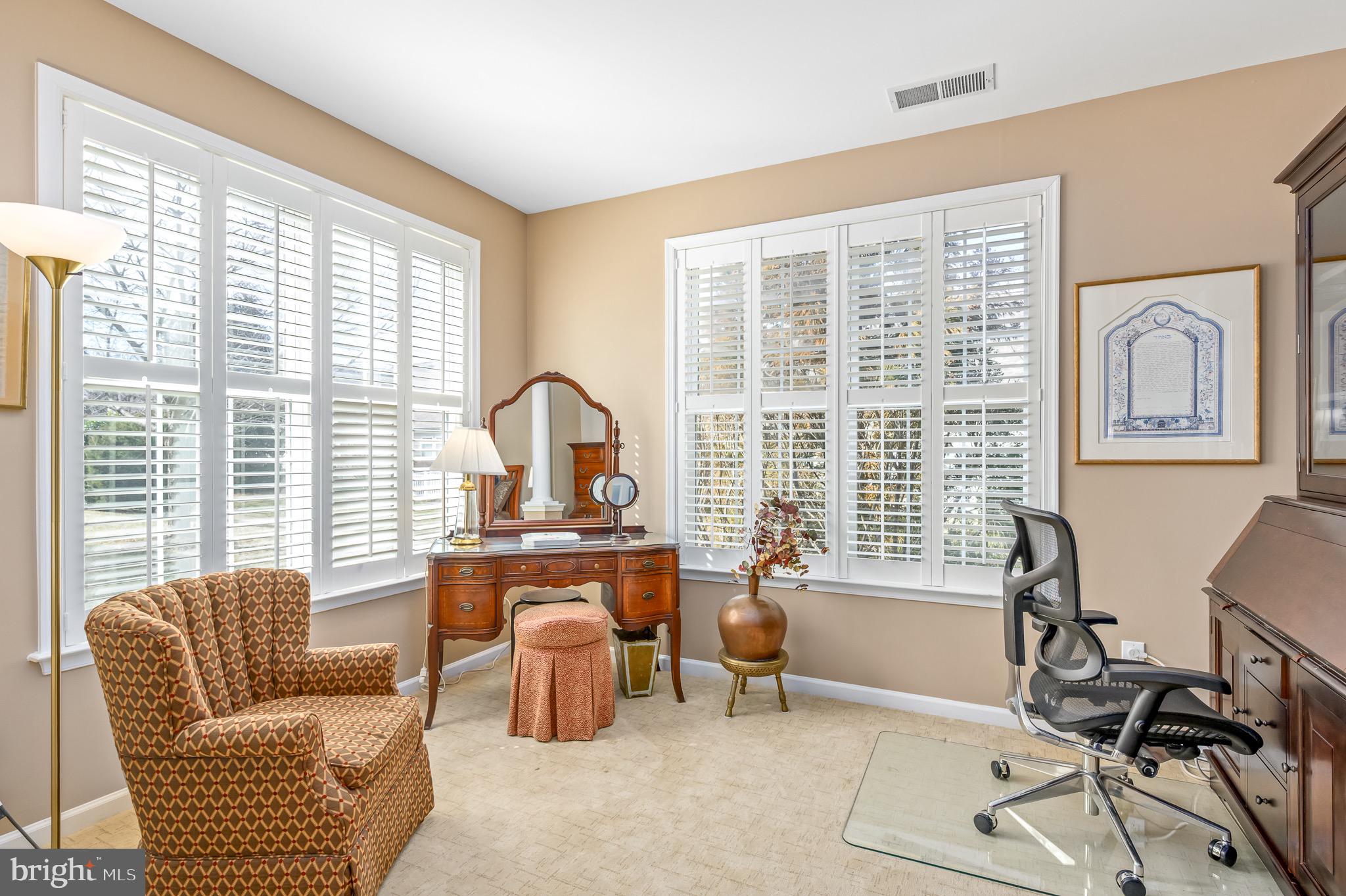 44550 Baltray Circle Ashburn, VA 20147 - Photo 27 of 44 a living room with furniture and a large window