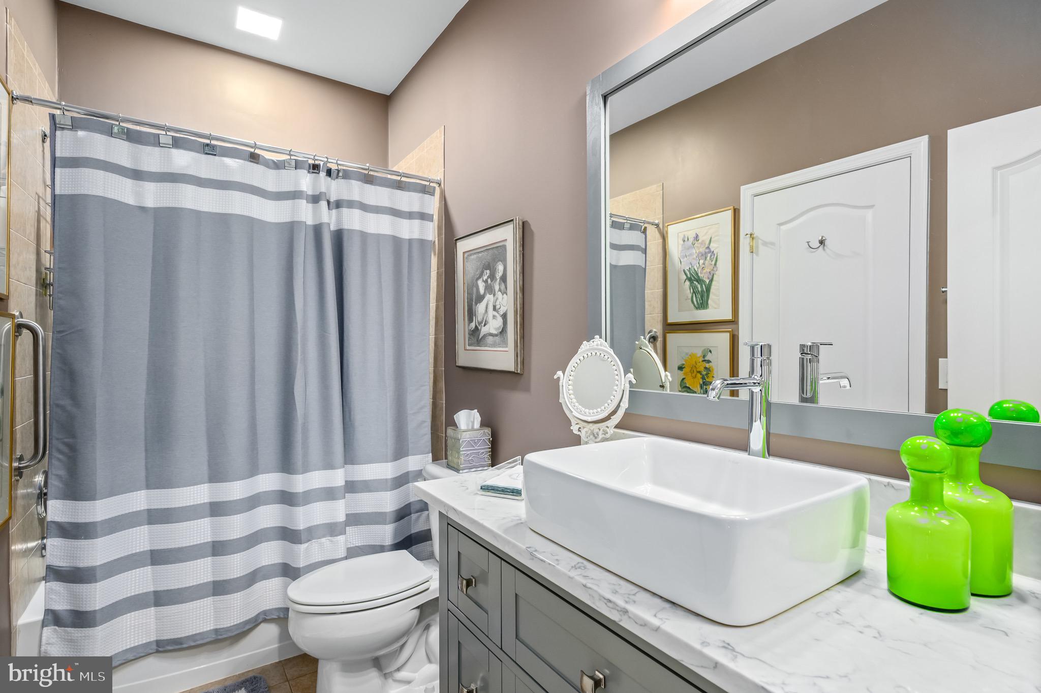 44550 Baltray Circle Ashburn, VA 20147 - Photo 32 of 44 a bathroom with a sink toilet and shower