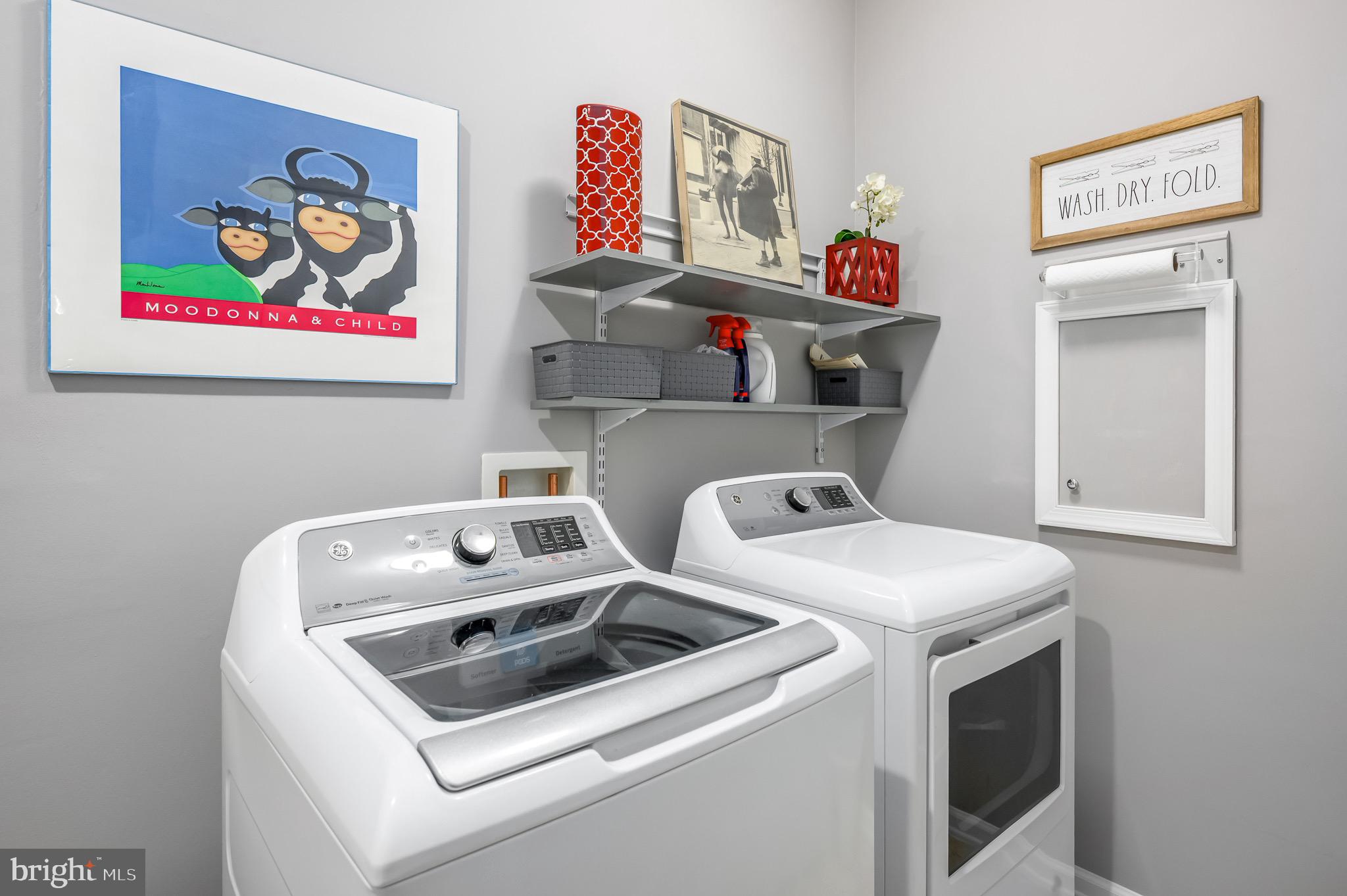 44550 Baltray Circle Ashburn, VA 20147 - Photo 33 of 44 a utility room with dryer washer and a view of living room