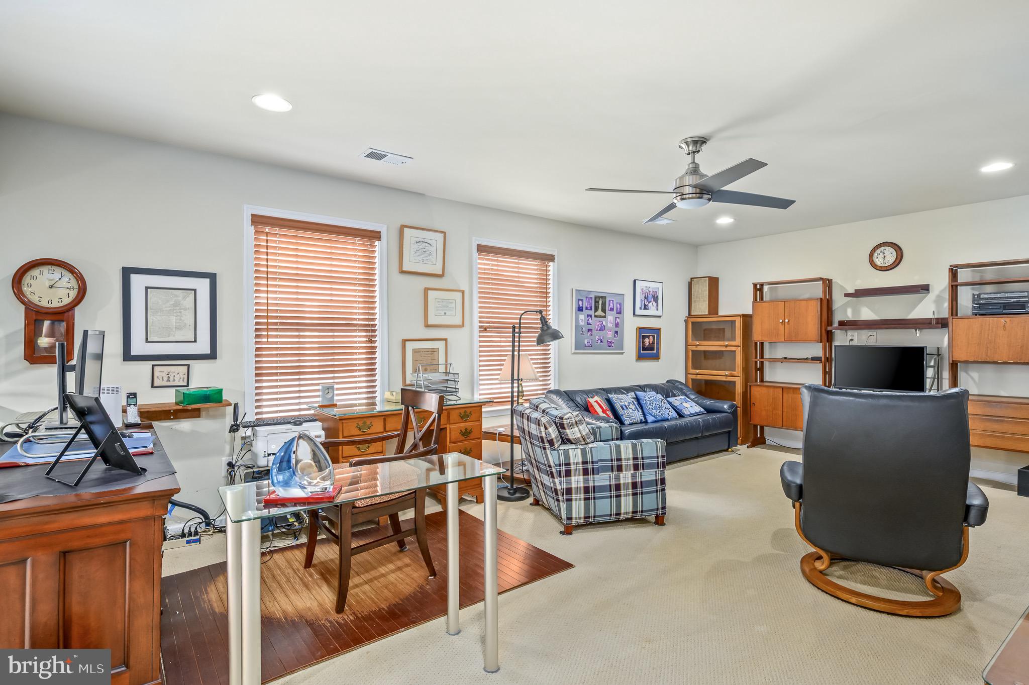 44550 Baltray Circle Ashburn, VA 20147 - Photo 36 of 44 a living room with furniture and a flat screen tv