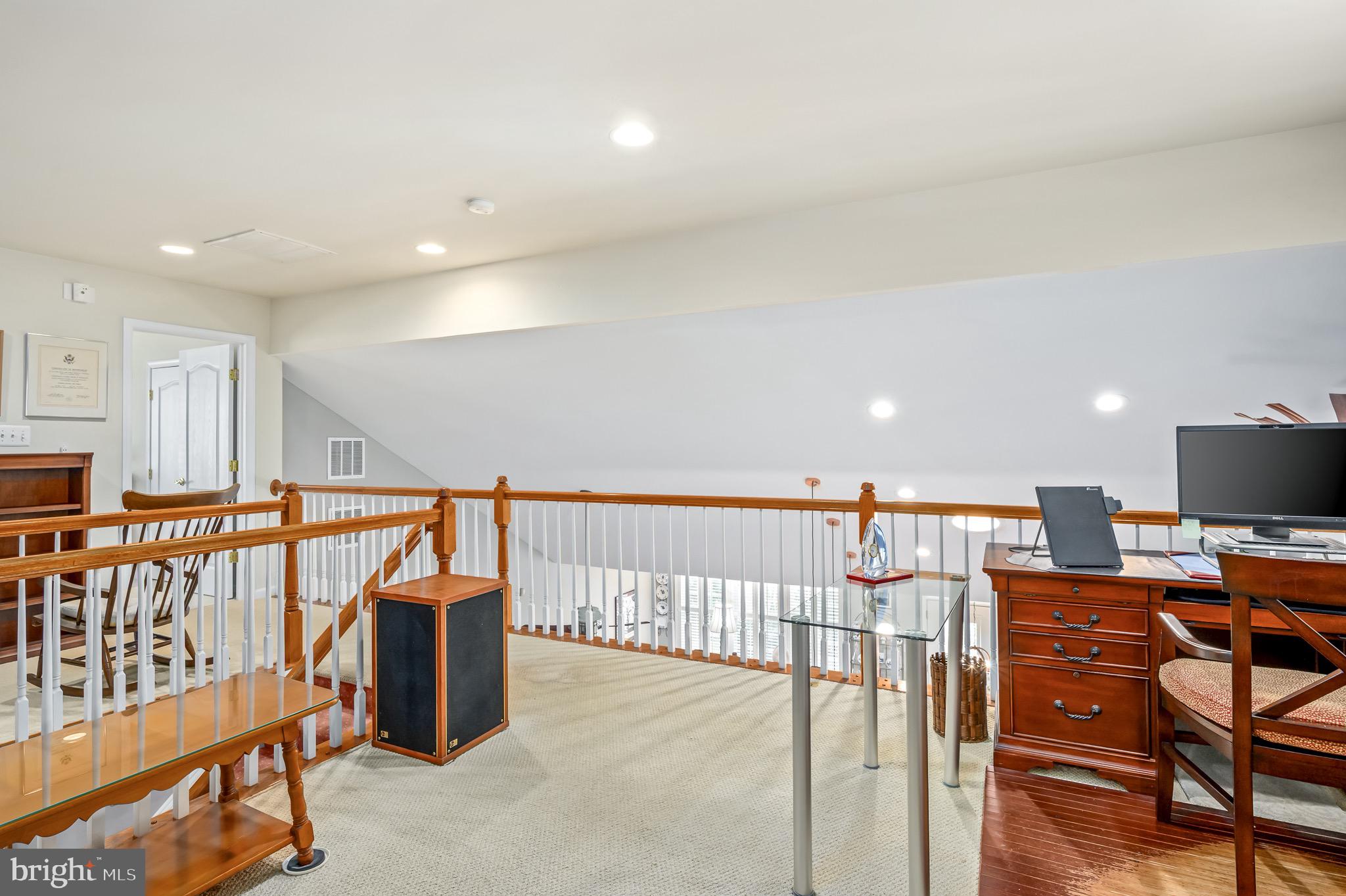 44550 Baltray Circle Ashburn, VA 20147 - Photo 37 of 44 a view of a hallway with seating area