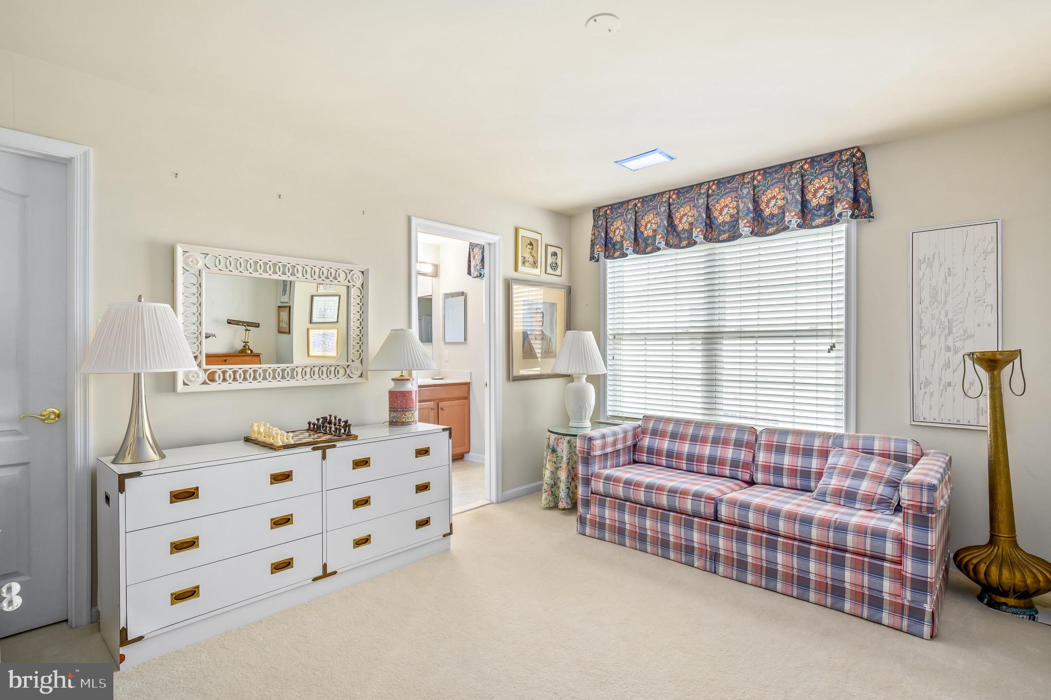 44550 Baltray Circle Ashburn, VA 20147 - Photo 39 of 44 a bedroom with furniture and a large window