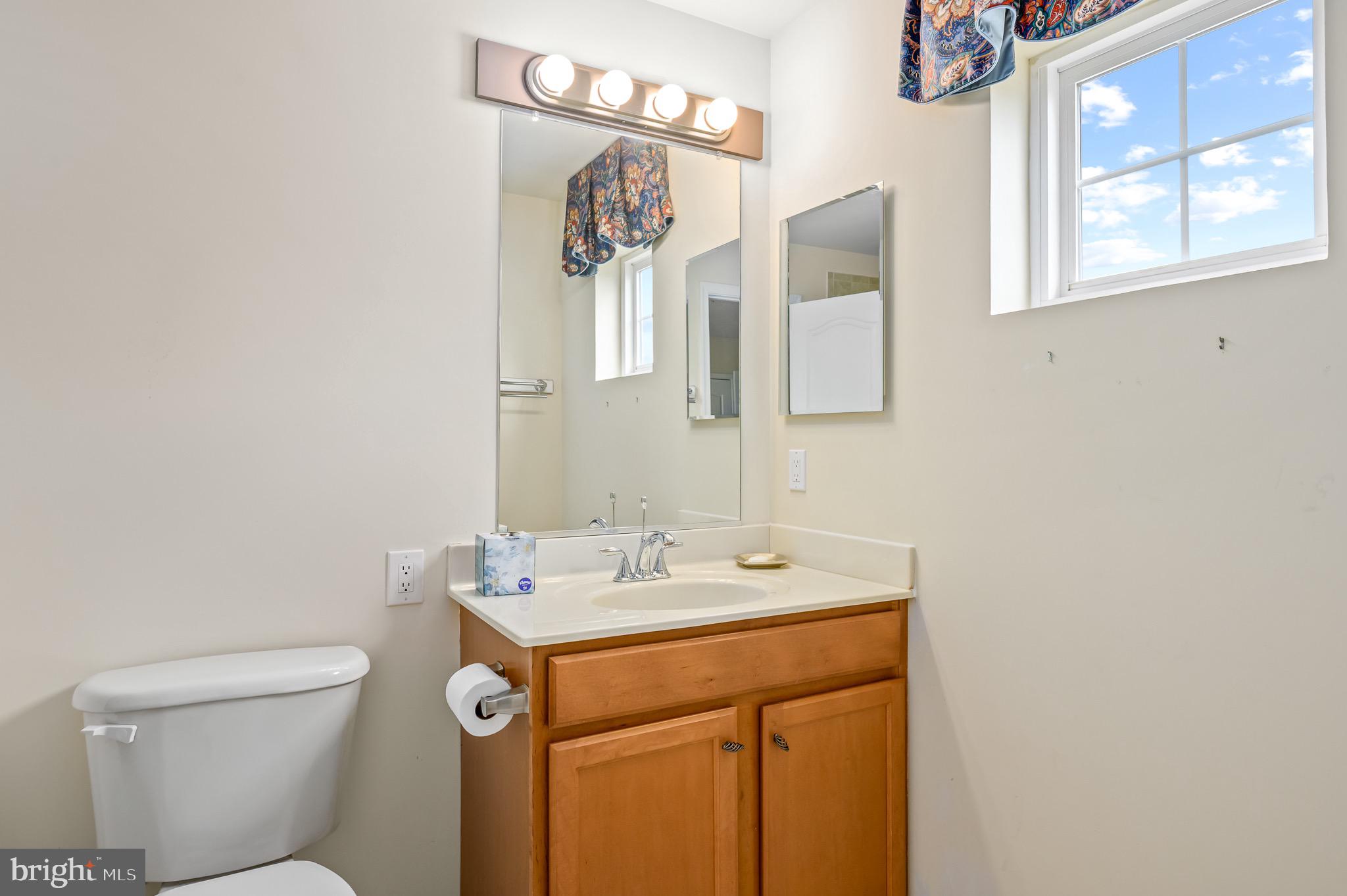 44550 Baltray Circle Ashburn, VA 20147 - Photo 41 of 44 a bathroom with a sink and a toilet