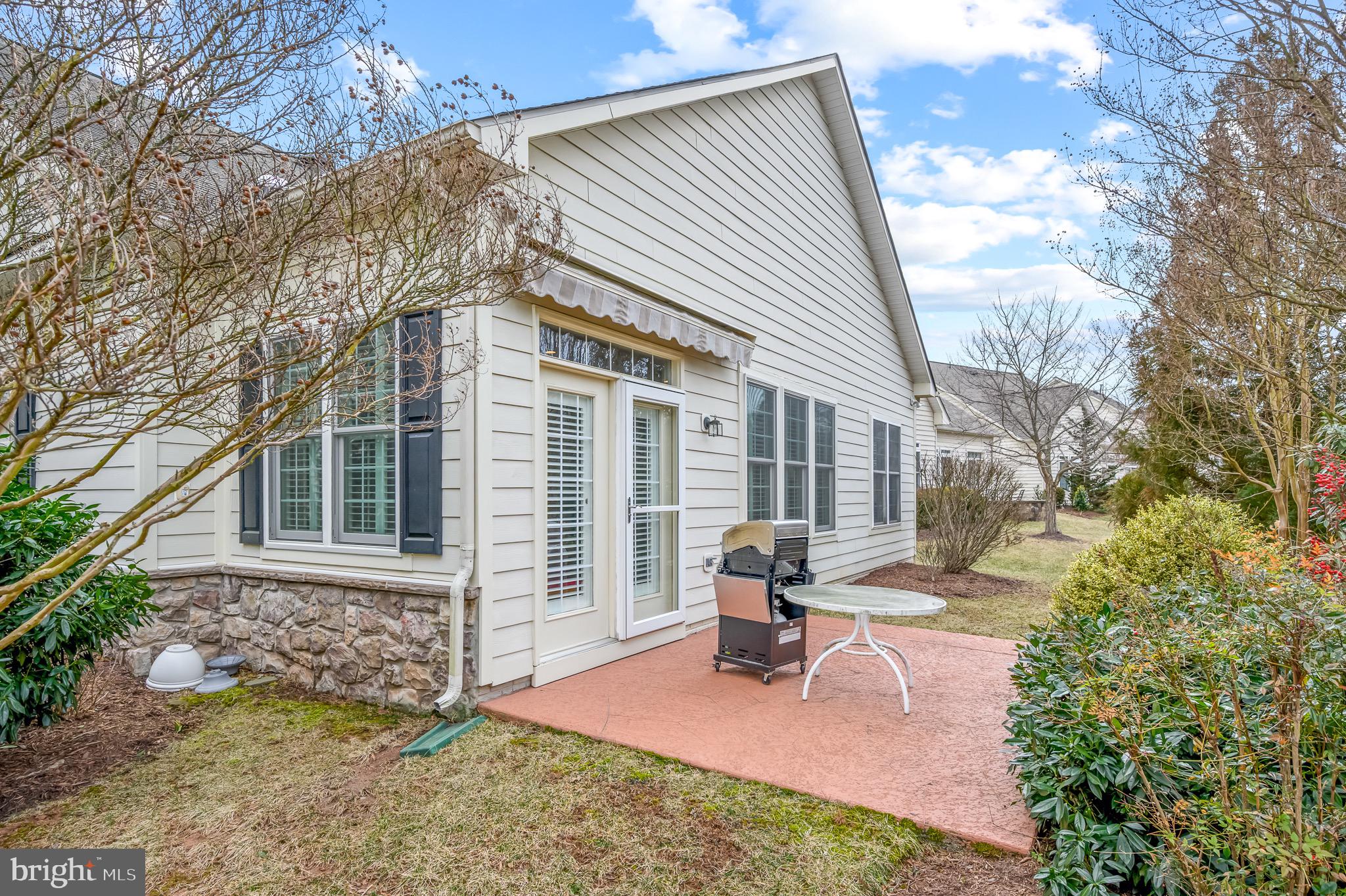 44550 Baltray Circle Ashburn, VA 20147 - Photo 42 of 44 a front view of a house with patio