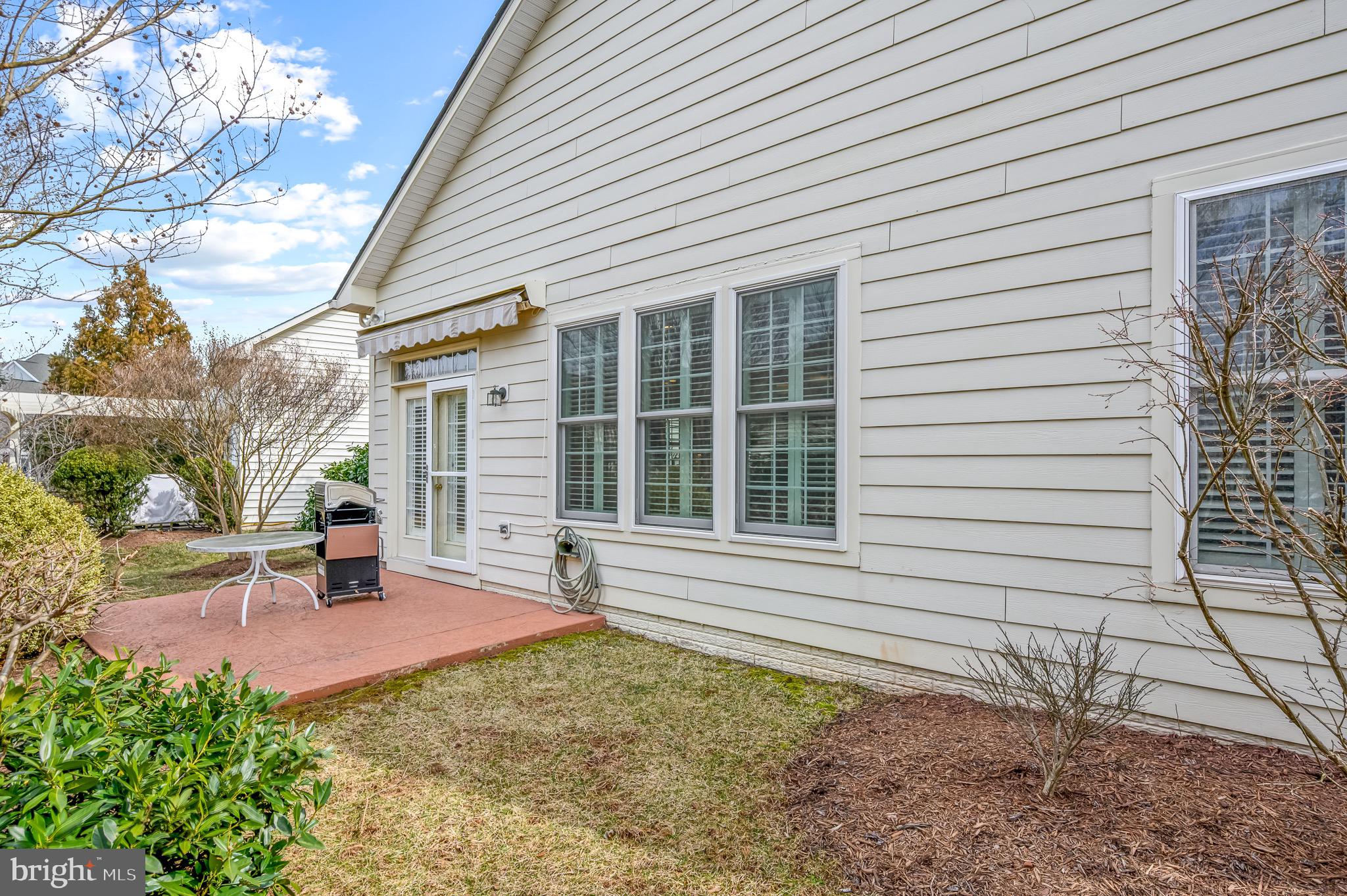 44550 Baltray Circle Ashburn, VA 20147 - Photo 43 of 44 a house view with a backyard space