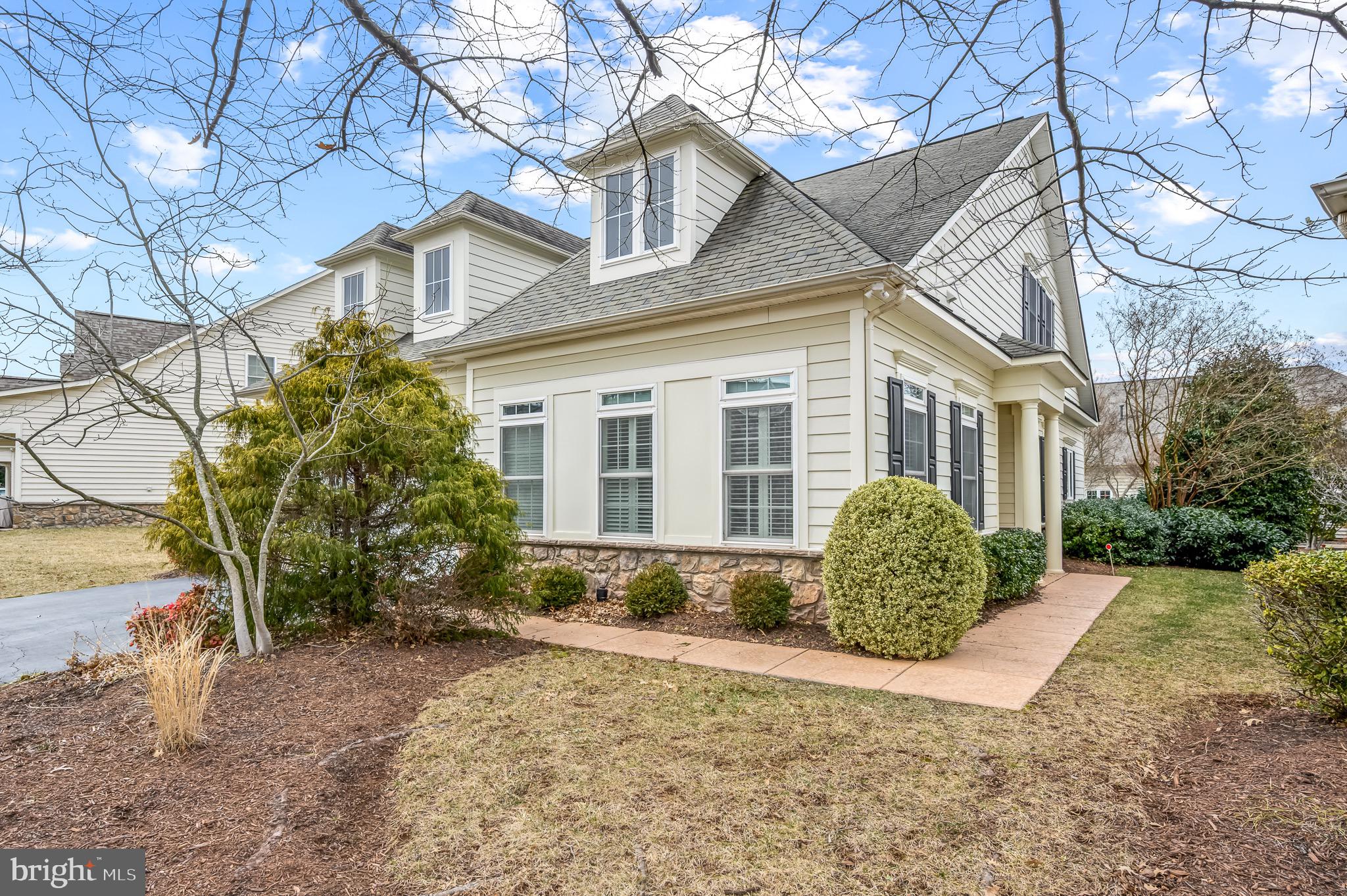 44550 Baltray Circle Ashburn, VA 20147 - Photo 5 of 44 a view of a house with a yard and large tree
