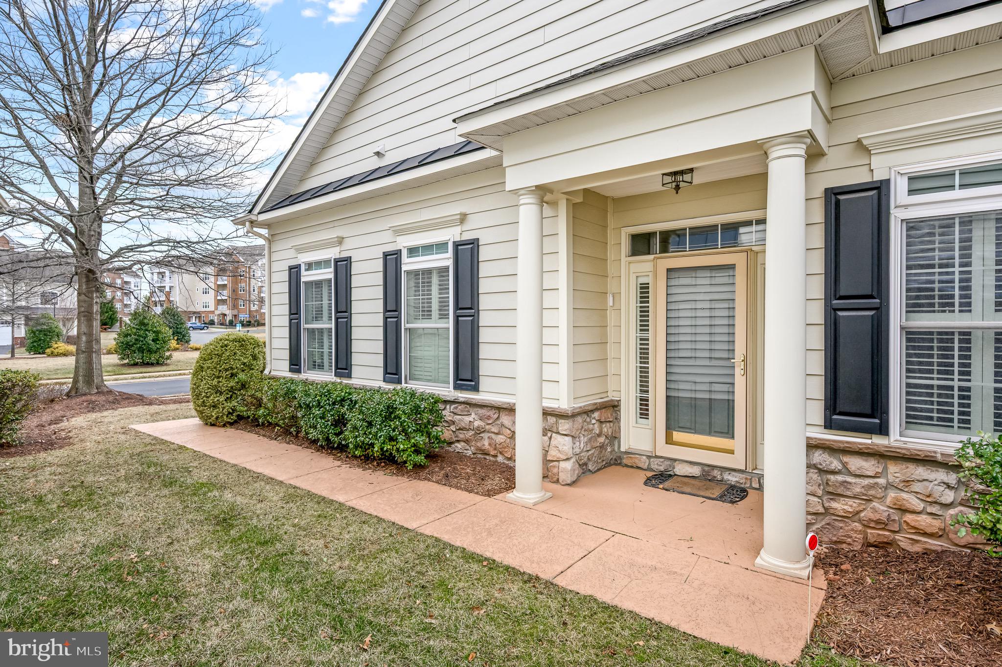 44550 Baltray Circle Ashburn, VA 20147 - Photo 6 of 44 a front view of a house with a yard