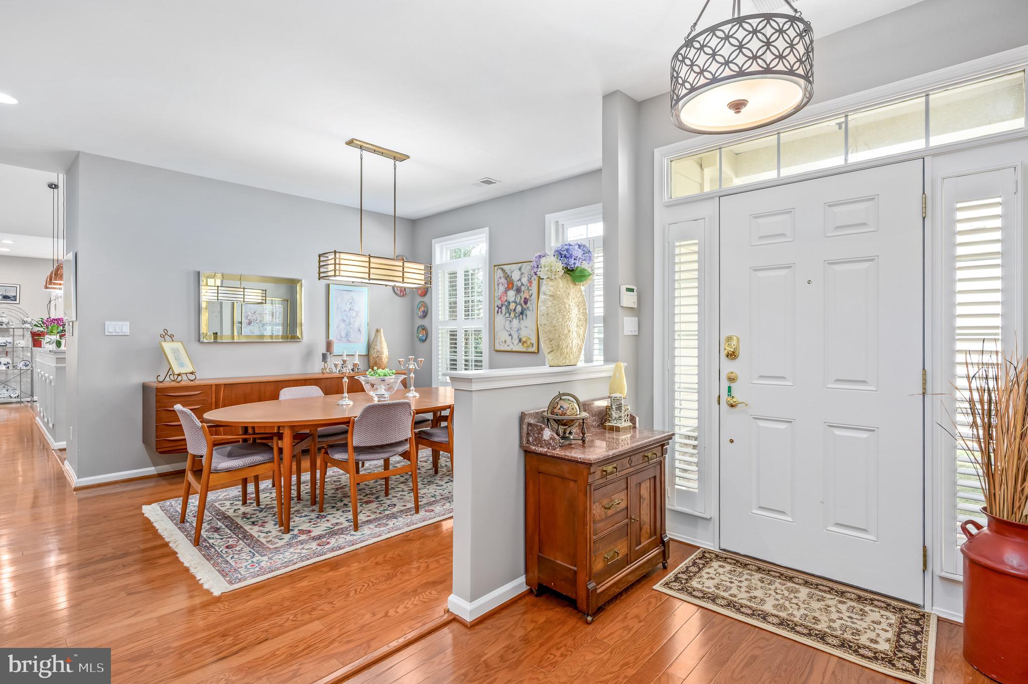 44550 Baltray Circle Ashburn, VA 20147 - Photo 8 of 44 a view of a dining room with furniture window and wooden floor